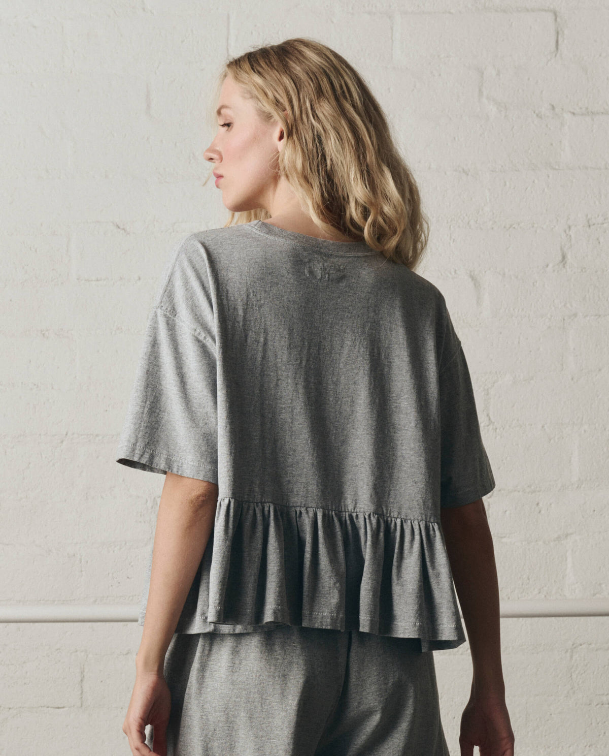 The Oversized Ruffle Peplum Tee. -- Heather Grey
